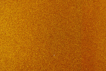 Fototapeta premium Background with sparkles. Backdrop with glitter. Shiny textured surface. Dark orange Brown tone