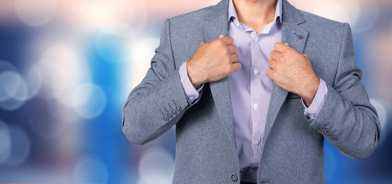 business man adjusting his suit