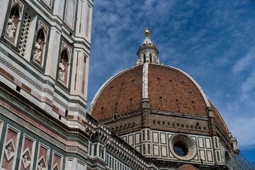 Florence Cathedral cupula in Italy with a blue sky in the background.