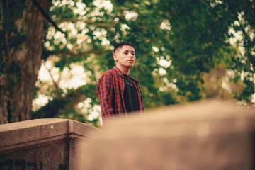 Fototapeta premium Young brunette boy in natural park