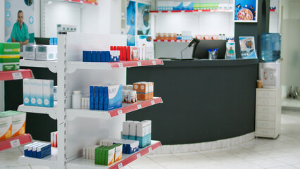 Empty pharmaceutical retail store filled with medicaments and vitamins on shelves, used by clients...