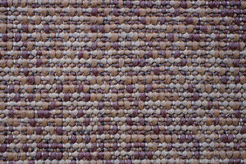 fabric texture from part of an old knitted brown gray carpet