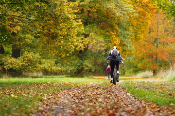 Cycling in the autumn park in europe