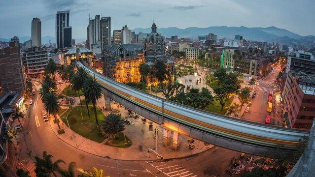 Dusk to night timelapse view of traffic around Plaza Botero square in Downtown Medellin, Antioquia Department, Colombia.  