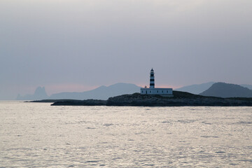 Fototapeta premium Lighthouse on a Mediterranean island during sunset.