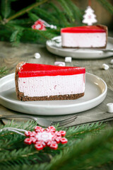 cheesecake New York slice with red jelly top. Christmas new year decorations,dessert holiday food