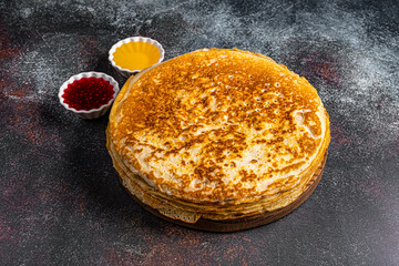 dish of pancakes on a dark background in a restaurant