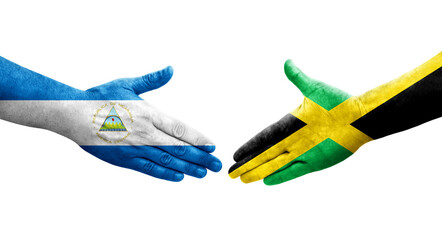 Handshake between Jamaica and Nicaragua flags painted on hands, isolated transparent image.