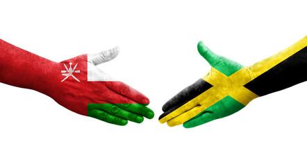 Handshake between Jamaica and Oman flags painted on hands, isolated transparent image.