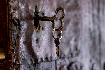 Old door with beautiful heart shape key