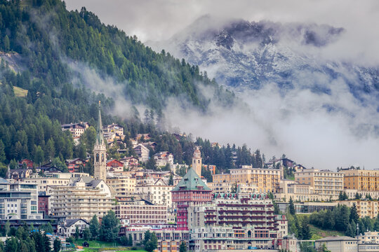 St Moritz cityscape under mountain mist, Engadine, Swiss alps, Switzerland
