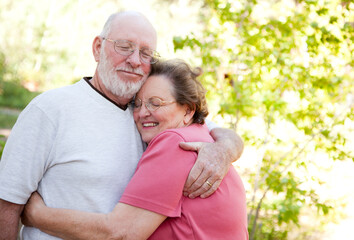 Obraz premium Loving Senior Couple Embracing Outdoors