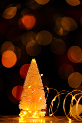 Christmas tree background with shining bokeh.Christmas tree Festive bokeh background.Christmas and...