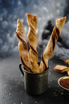 Puff pastry chocolate hazelnut twist topped with sugar and nuts