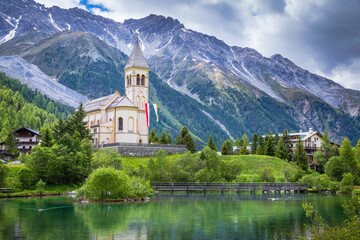 Fototapeta na wymiar Church and Solden village near Passo dello Stelvio, South Tyrol alps, Italy