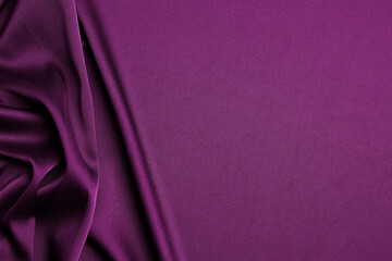 Crumpled purple silk fabric as background, top view. Space for text