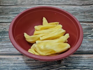 Fototapeta na wymiar Slices of ripe yellow jackfruit in a container