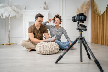 artist couple making video blog or course record instruction on camera
