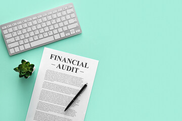 Naklejka premium Business document, pen and keyboard on green background