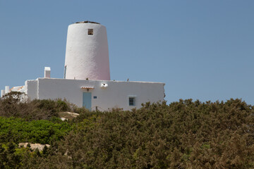 Fototapeta na wymiar tower-shaped house on an island in Spain
