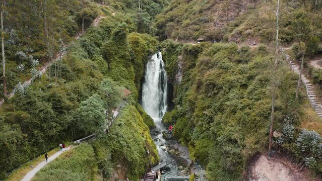 Cascading View Of Peguche Waterfall In Otavalo. Aerial Rising, Tilt Down Shot