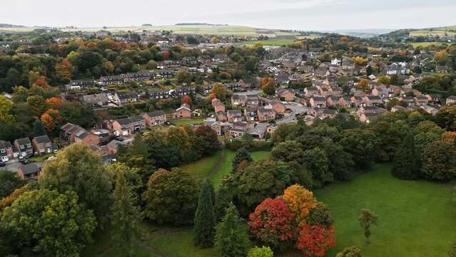 Drone footage of Penistone Town and Viaduct near Barnsley, South Yorkshire. Showing a ploughed field, bridge, woodland and railway tracks.
