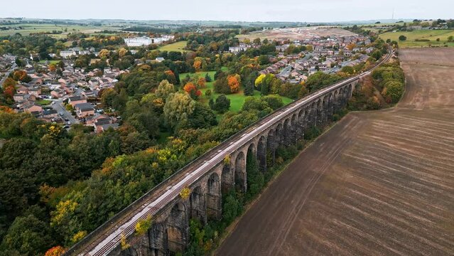 Drone footage of the Penistone Railway Viaduct near Barnsley, South Yorkshire, UK.
Showing a ploughed field, bridge, woodland and railway tracks.