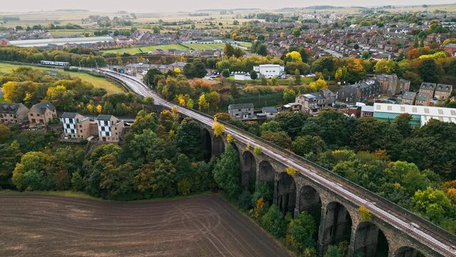 Drone aerial footage of the Penistone Railway Viaduct near Barnsley, South Yorkshire.
Showing a ploughed field, bridge, woodland and railway tracks.