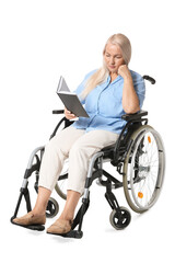 Fototapeta na wymiar Mature woman in wheelchair reading book isolated on white