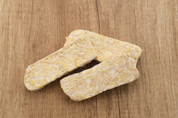 Raw Tempeh, Tempeh or Tempe, Indonesian traditional food, made from fermented soybeans. Usually fried for a side dish or for other cooking ingredients.
