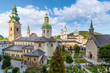 Fototapeta na wymiar View of the towers and skyline of Salzburg, Austria, from the 12th century catacombs and chapels of Saint Peter's Petersfriedhof Monastery, Cemetery and Catacombs.