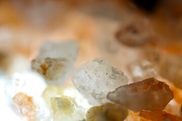 Quartz sand (Amber quartz) gravel with a sense of transparency texture. Close-up photography with a high-magnification macro lens.