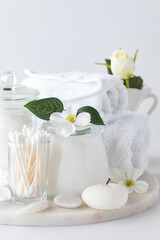 Close up view of a collection of cleansing items against a light background.