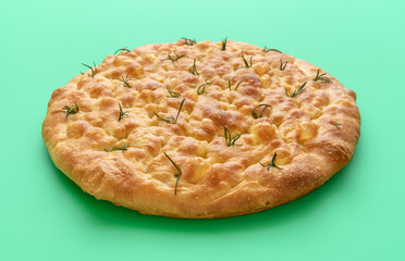 Homemade focaccia minimalist on a green background