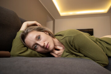 young woman at home on sofa