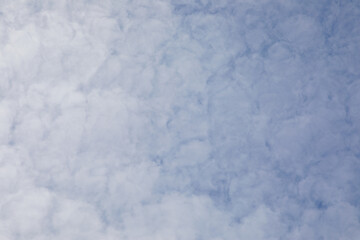 Cloudy daytime sky can be used as a background image.