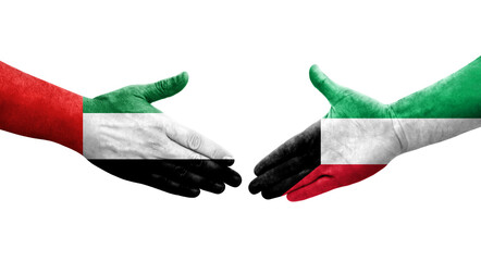 Handshake between Kuwait and UAE flags painted on hands, isolated transparent image.