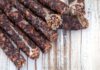 Traditional South African dry wors or sausage on rustic white with copy space