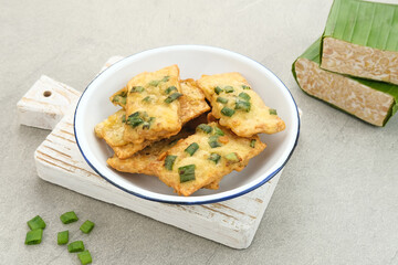Tempe Mendoan, traditional fried tempeh, one of popular food from Indonesia.
