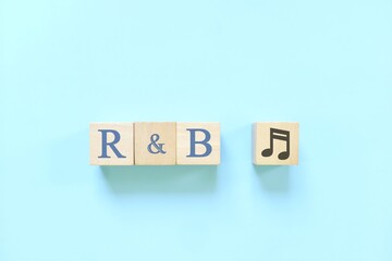 Rhythm and blues or R&B music genre or style concept. Creative flat lay typography composition in blue background.