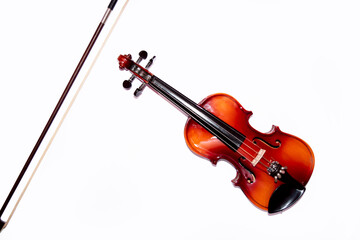 Front view of violin with violin bow isolated on white background