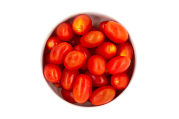 Red cherry tomatoes in a bowl isolated on white background. View from the top