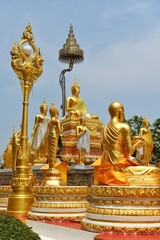 Various Buddha statues are located beside the chapel of Wat Phra That Phanom. This temple is a popular pilgrimage destination for those born in the year of the Monkey.