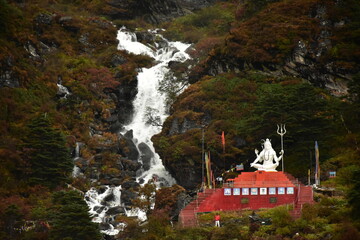 Lord Shiva beside the waterfall