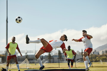 Sports, soccer and soccer player with team and soccer ball in power kick while playing on soccer...