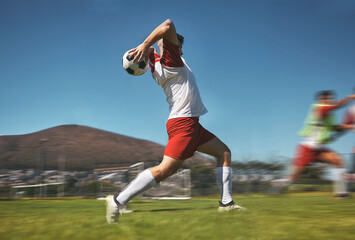 Training, man and soccer ball throw on soccer field during game or competition outdoor. Sports,...