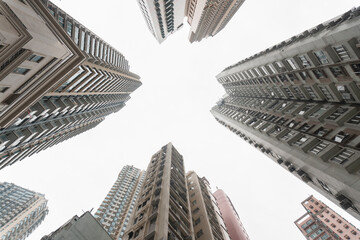 Obraz na płótnie Canvas Low angle shot of a residential building, a commercial building.