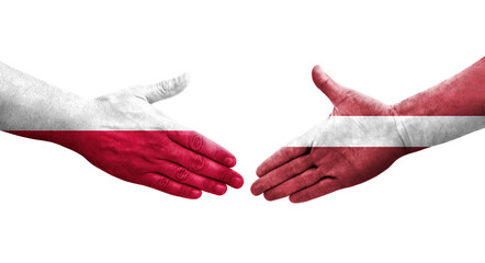 Handshake between Latvia and Poland flags painted on hands, isolated transparent image.