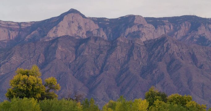 Steady shot of the Sandia Mountains in Albuquerque New Mexico during sunset.