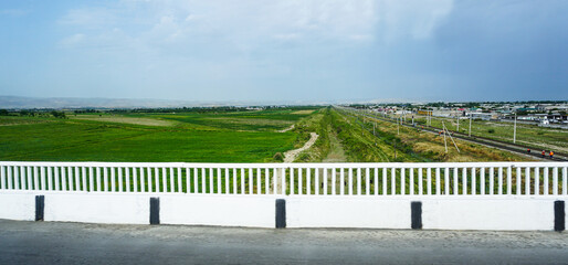 The road is visible under the bridge